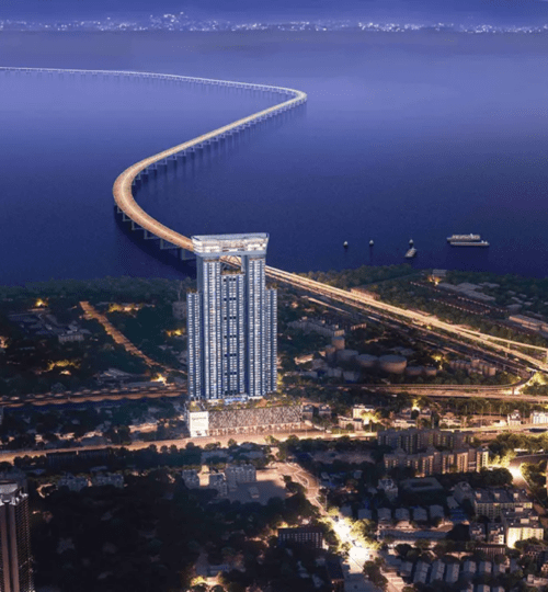 Aerial night view of L&T The Gateway Sewri with Mumbai Trans Harbour Link and city lights in the background.